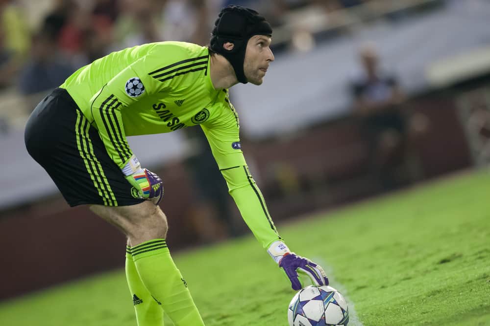 Petr Cech gets ready to kick a ball for Chelsea What Gear Does A Soccer Goalie Need?but